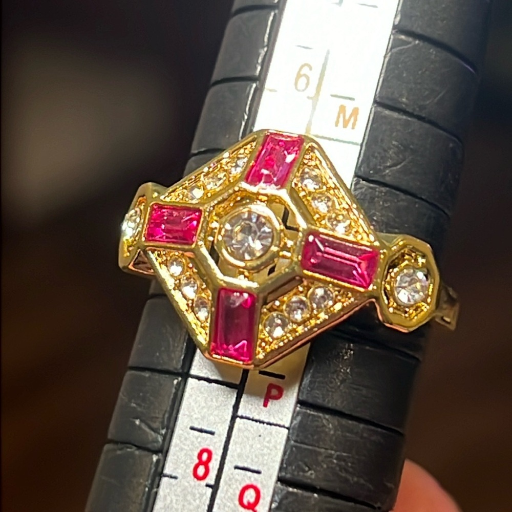 Gold Ring with Pink Gem Accents and Clear Stones